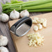 Nisbets Essentials Curved Garlic Press Nisbets Essentials